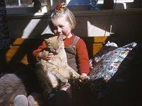 Young Robyn with cats