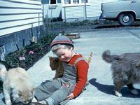 Young Robyn with cats