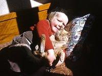 Young Robyn with cats